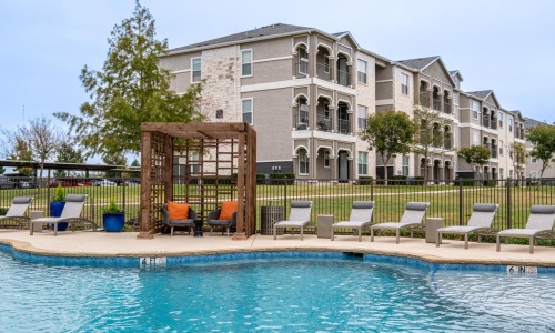 a pool with chairs around it