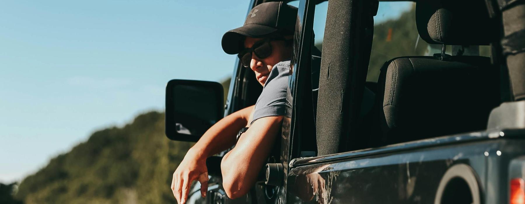 a person driving a jeep