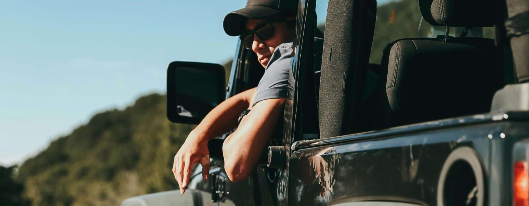 a person driving a jeep