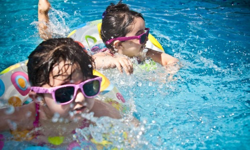 kids swimming in a pool