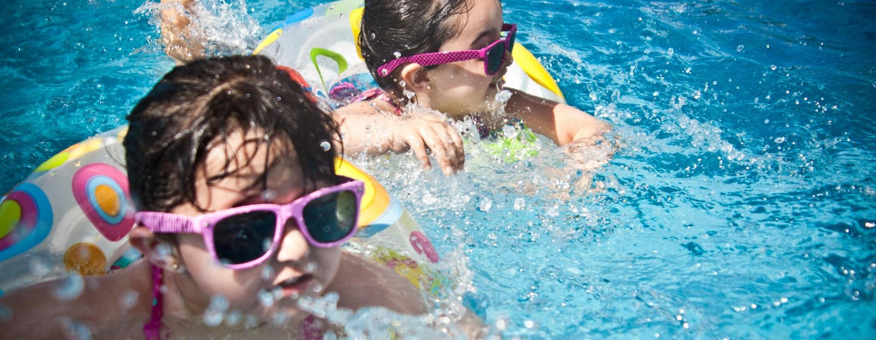 kids swimming in a pool