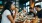 a group of people eating at a restaurant