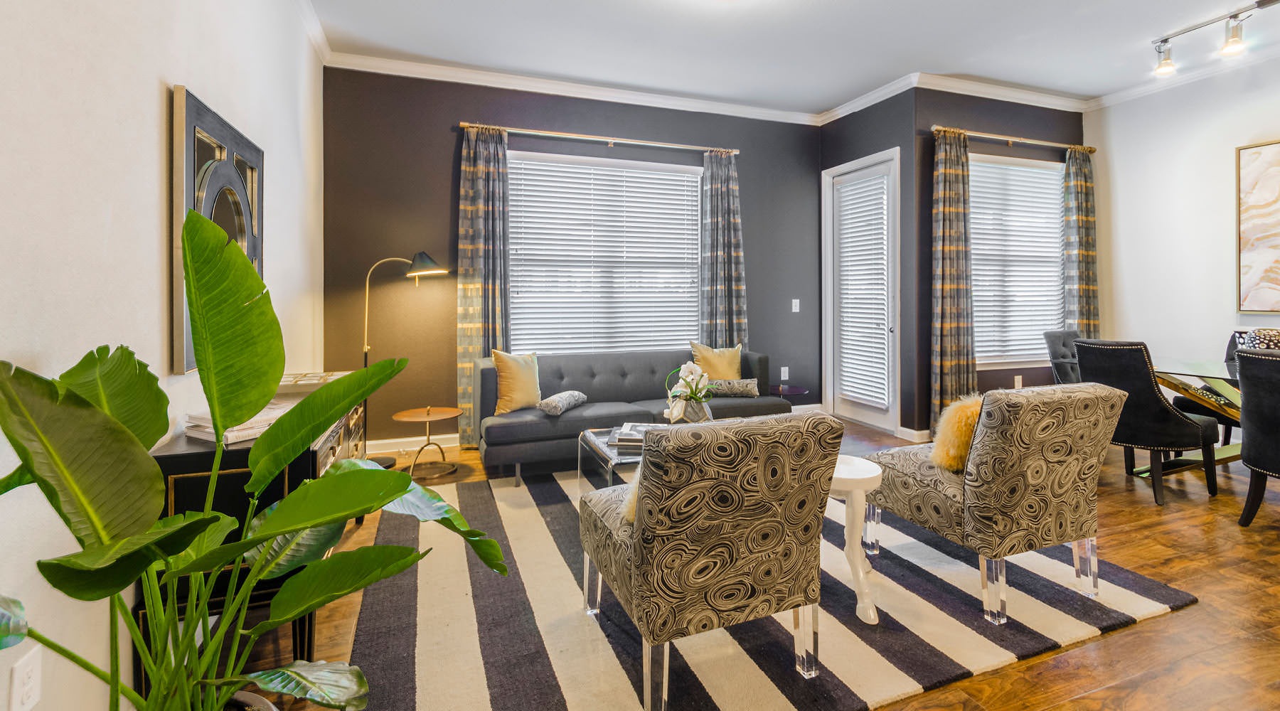 Relax and unwind in well-lit living areas living room with access to private balcony