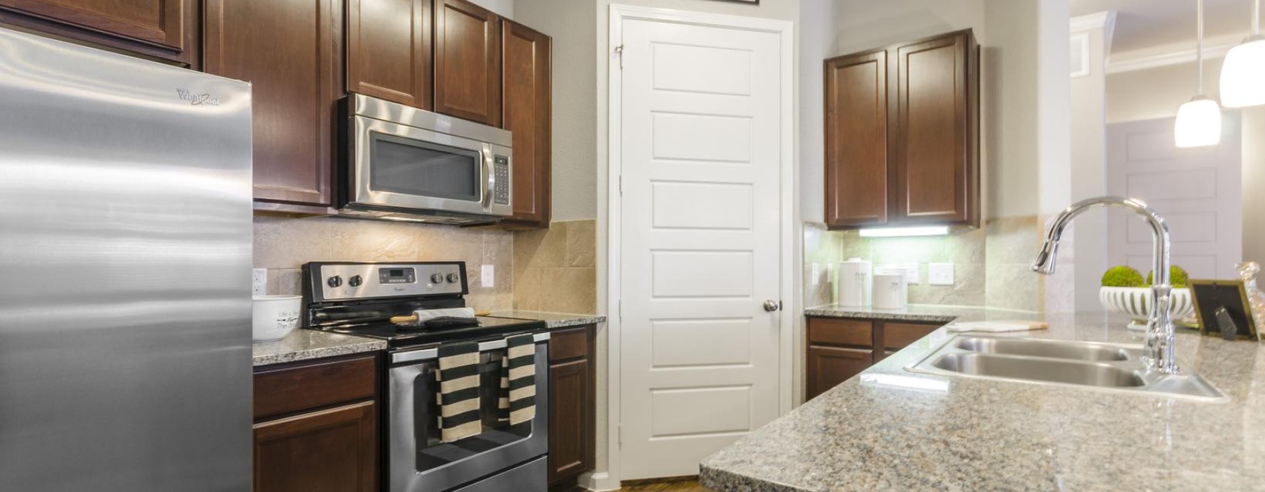 a kitchen with under cabinet lighting